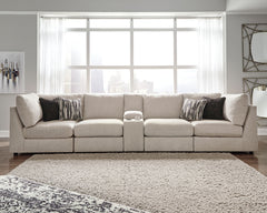 With its casual-contemporary aesthetic and modular design that simply makes sense, the Kellway sectional makes way for high style and indulgent comfort. Rest assured, the thickly cushioned storage console includes not only a pair of cup holders, but also 