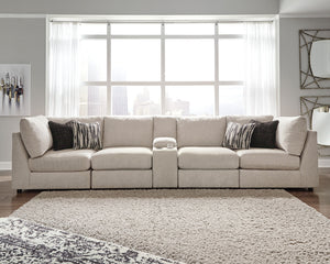 With its casual-contemporary aesthetic and modular design that simply makes sense, the Kellway sectional makes way for high style and indulgent comfort. Rest assured, the thickly cushioned storage console includes not only a pair of cup holders, but also 
