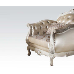 The Chantelle chair is filled with romantic wonder. This chair features a rose gold PU seat back, floral pattern and PU seat cushions, with pearl white wood finish, crystal like button tufted back, arms, and back, and tight back with loose seat cushions. 
