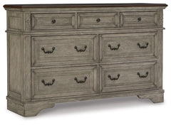 Cottage quaint styling and quality construction make this dresser a dream come true. A two-tone finish provides rustic warmth, with an antiqued gray body and a rich, deep walnut on the top. Framed drawer fronts and dark bronze-tone hardware marry classic 