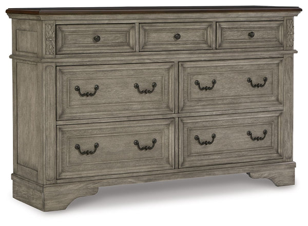 Cottage quaint styling and quality construction make this dresser a dream come true. A two-tone finish provides rustic warmth, with an antiqued gray body and a rich, deep walnut on the top. Framed drawer fronts and dark bronze-tone hardware marry classic 