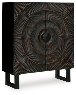 High style is on the rise with this wood accent cabinet. Its stunning doors, graced with a carved sunburst pattern and oversized wood pull, open to reveal two shelves. A distressed black finish adds contemporary flair. Whether this cabinet is accommodatin