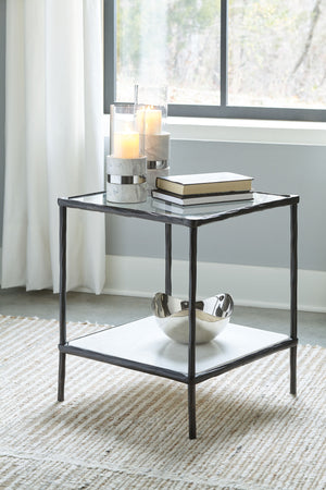  this accent table provides both flair and function. The glass tabletop offers the perfect perch for a lamp