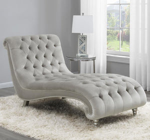  this piece creates an eye-catching display. All-over button tufting is enhanced with metallic buttons. Nail head trim adorns the frame for st
