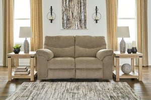  this reclining loveseat invites a relaxed sensibility into your space. Its neutral upholstery has a universal appeal