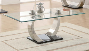  showcasing a tempered glass top for enhanced durability and style. The dual curved bases feature a brushed satin silver finish