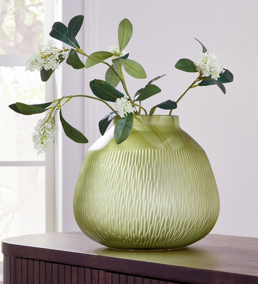 Creating a contemporary haven is all in the details. With this vase, you can keep your elevated aesthetic consistent from indoors to out. Its luxe green color brings a touch of brightness to your tabletops and shelves. Take on-trend design one step furthe