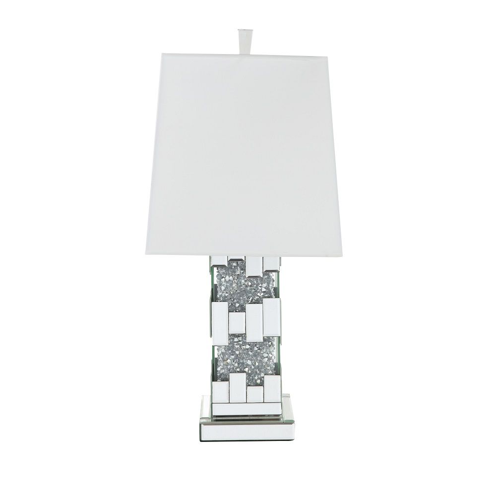 Wonderful mixture between stylish design and modern technology, this Noralie Table Lamp will bring a touch of Hollywood glamourous to any room space. Featuring cuboid shape with mirrored finish and trimmed with clear glass of faux diamond inlayed, this pi