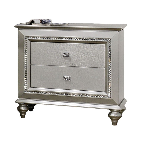 The Kaitlyn nightstand provides a commanding presence in any room. Crafted with a transitional look that is an ideal addition to any bedroom, the nightstand is accented with textured front and a crystal-like sparkling trim. Its crystal-like trimming creat