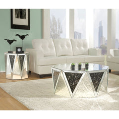 The Noor mirrored occasional table will add a modern glam style to your living room. This drum table features a sleek and unique style with its octagonal top, triangular base, and crystal inserts. Add this coffee table to any room to add to add style and 