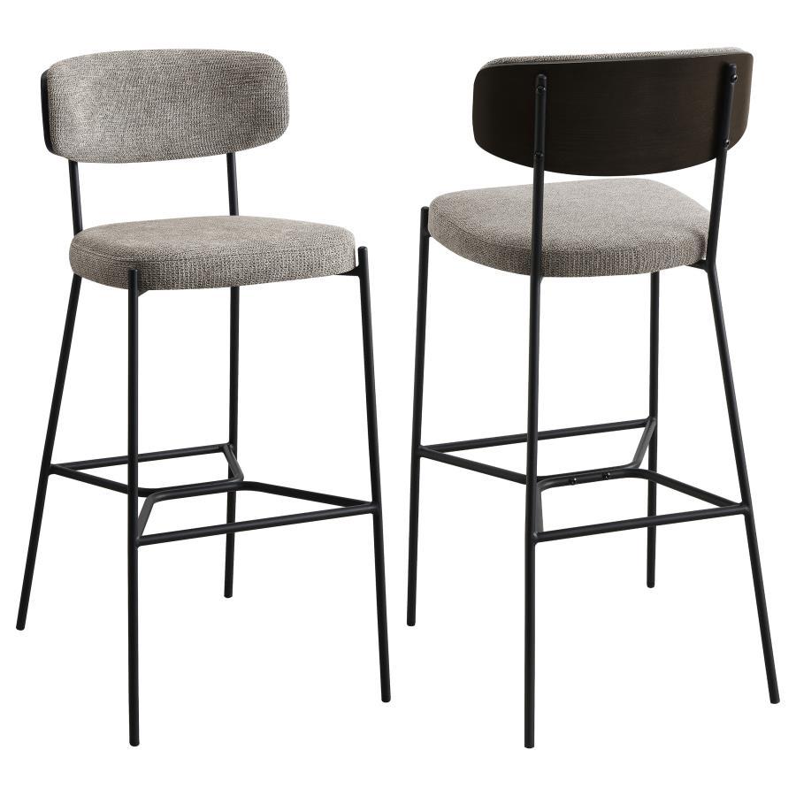 Create a relaxed and inviting ambiance at a kitchen bar or in your home lounge with a set of two modern barstools. Each boasts a durable and strong metal frame with a sandy black finish. Dark oak finish backrests complement neutral upholstery, offering fo