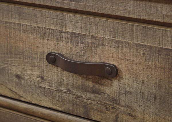  plank-style details and nailhead trim pay homage to reclaimed barn wood