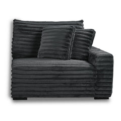 The Embrace Right Arm Facing Chair with 2 Accent Pillows in charcoal gray is a sophisticated and comfortable addition to your sectional arrangement. Featuring 100% charcoal gray polyester fabric with a fluffy, blanket-like texture, this chair promises ult