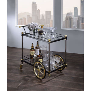 Serve meals fashionably with this lovely Cyrus serving cart. It pairs perfectly with clear tempered glass for a look of refined sophistication. Two tiers easily accommodate trays and entrees, while wheels and a metal handle make it simple to move this dai