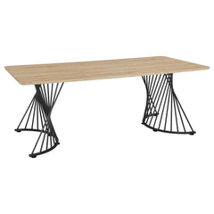 Make a statement in your dining room with this sculptural rectangular table, combining rustic charm and industrial flair. Featuring a natural oak grain top with a durable, easy-care laminate veneer, it sits on bold dual pedestal bases crafted from twisted