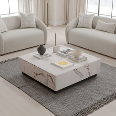 Introducing the Fritzy collection, a masterpiece of modern elegance in a striking white finish. These pieces, characterized by clean lines and a chic aesthetic, elevate any living space with their sophisticated presence. The coffee table and the uniquely 