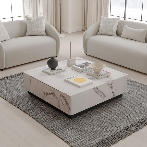 Introducing the Fritzy collection, a masterpiece of modern elegance in a striking white finish. These pieces, characterized by clean lines and a chic aesthetic, elevate any living space with their sophisticated presence. The coffee table and the uniquely 