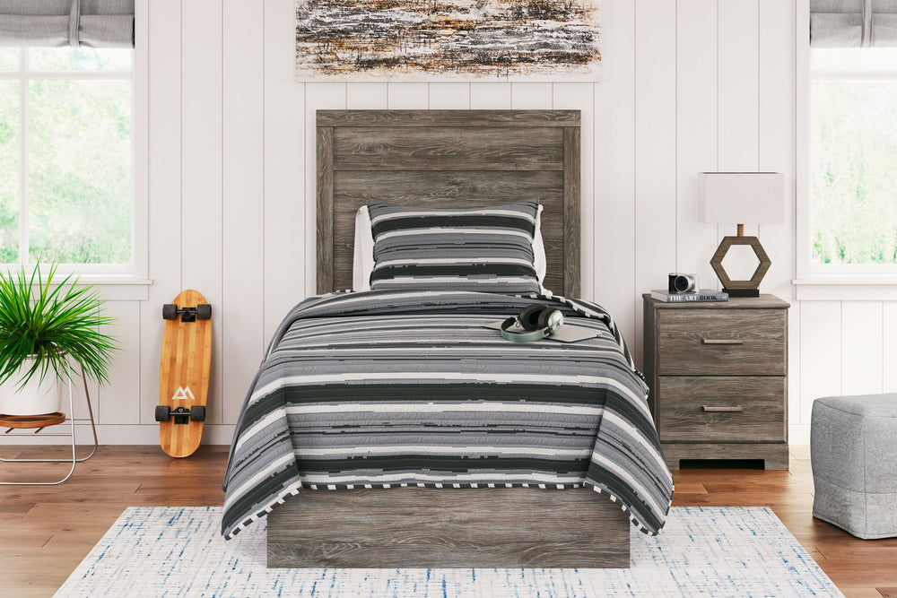 With its clean-lined look and modern attitude, this panel bed is a fresh style awakening. A warm gray hue over replicated oak grain easily complements other furniture finishes. The simple, unadorned profile is given depth and dimension with the addition o