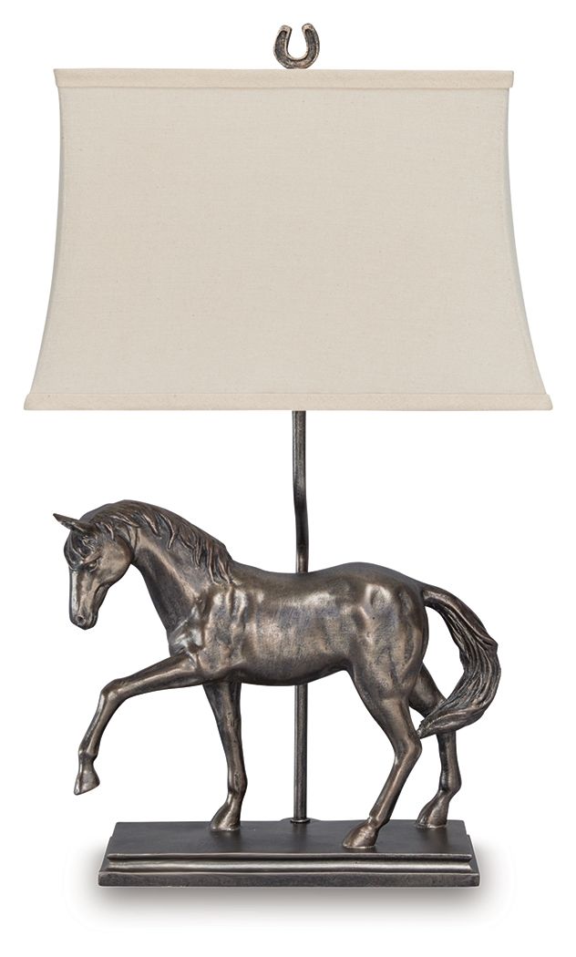 Why settle for standard light fixtures when this table lamp adds so much traditional charm to your space? It beautifully captures the equine form in detail, with an antiqued bronze-tone finish adding to its regal air. Whether it-'s lighting a living area,