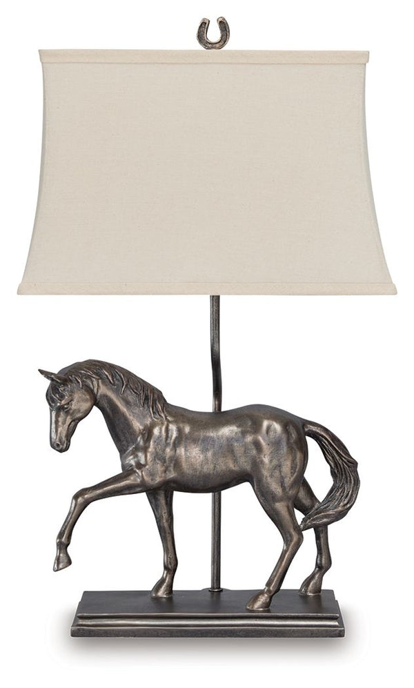 Why settle for standard light fixtures when this table lamp adds so much traditional charm to your space? It beautifully captures the equine form in detail, with an antiqued bronze-tone finish adding to its regal air. Whether it-'s lighting a living area,