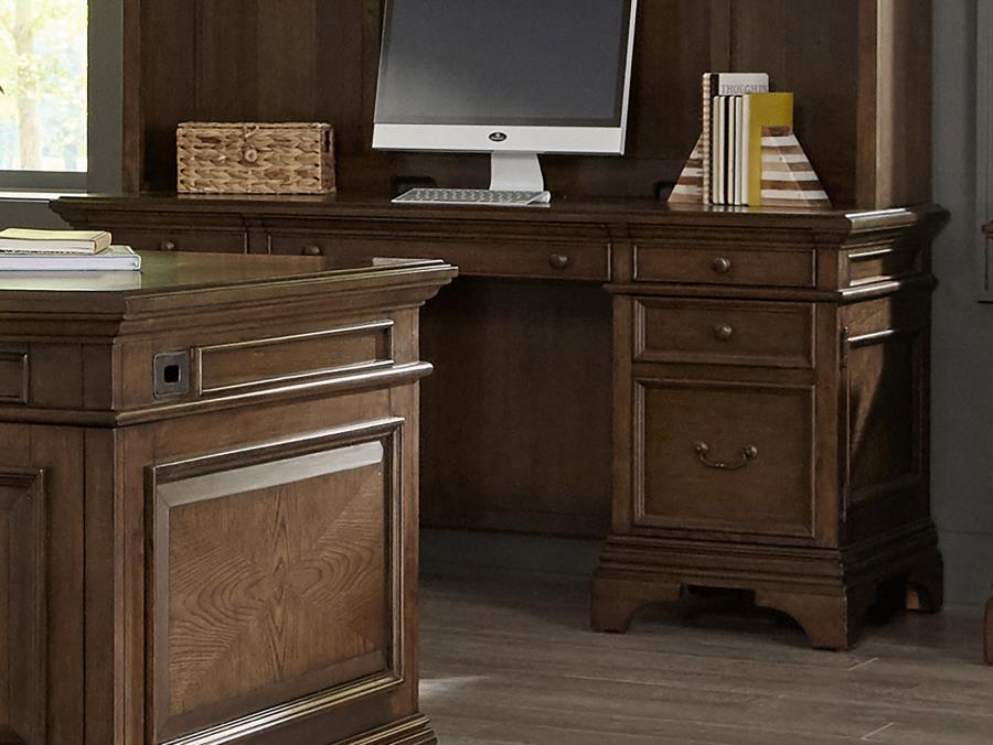 Get creative in how you use and style this attractive Credenza. Its warm burnished oak finish enhances its frame while supported on bracket style legs. Plenty of storage is found within its felt-lined top drawers. Removable dividers allow for extra organi