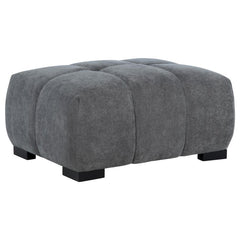 Add versatility and comfort to your seating area with this plush, mid-century inspired ottoman. Its soft, neutral upholstery and subtle grid tufting bring depth and texture to your dÃ©cor, while a sturdy frame ensures lasting durability. Ideal as a footre