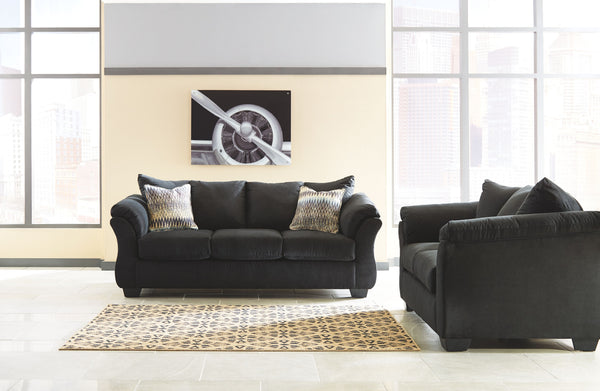 Everyone can have the best seat in the house with this sofa and loveseat. An indulgent choice with deep seats crafted for cloud-like softness, this set is the ideal merger of modern flair and classic staying power. <h4><b>Darcy - Black - Sofa</b></h4> <ta