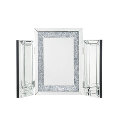 Display your dazzling sense of style by topping your vanity with the Noralie tri-fold mirror. This trifold mirror features a beveled mirrored frame with faux diamonds inlay. Each piece is hinged, allowing you to adjust the position of the side panels.<br/