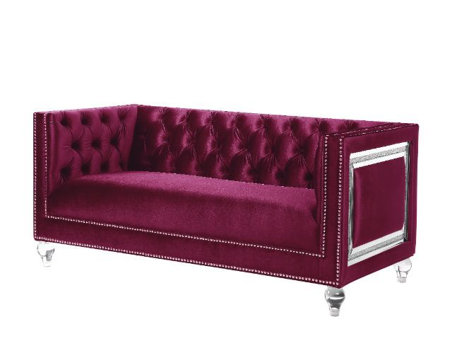 Looking to create a glamorous living room, look no further. The Heibero collection is ideal for that. Featuring timeless button tufting and the more modernized fine details such as the mirrored trim accents. The burgundy velvet upholstery is an eye-catche