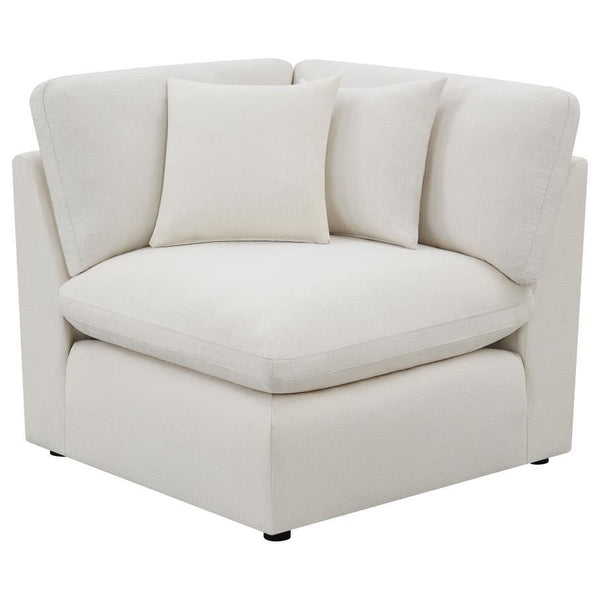  textural fabric. Feather blend-wrapped box cushion seating with reversible cushions and topstitched details
