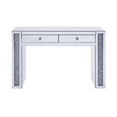 The Noralie Vanity Desk will give any room a touch of glamour. This contemporary desk is fully mirrored with a stunning mirror top and a faux diamond inlay on each leg of its sled base. Use this unique vanity desk for make-up application, jewelry, or as a