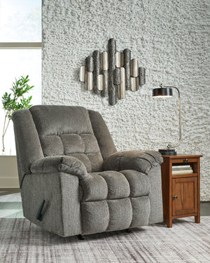  this rocker recliner-'s supremely plush seating lines you up for hours of leisure. Its one-pull reclining motion places you in optimal TV watching