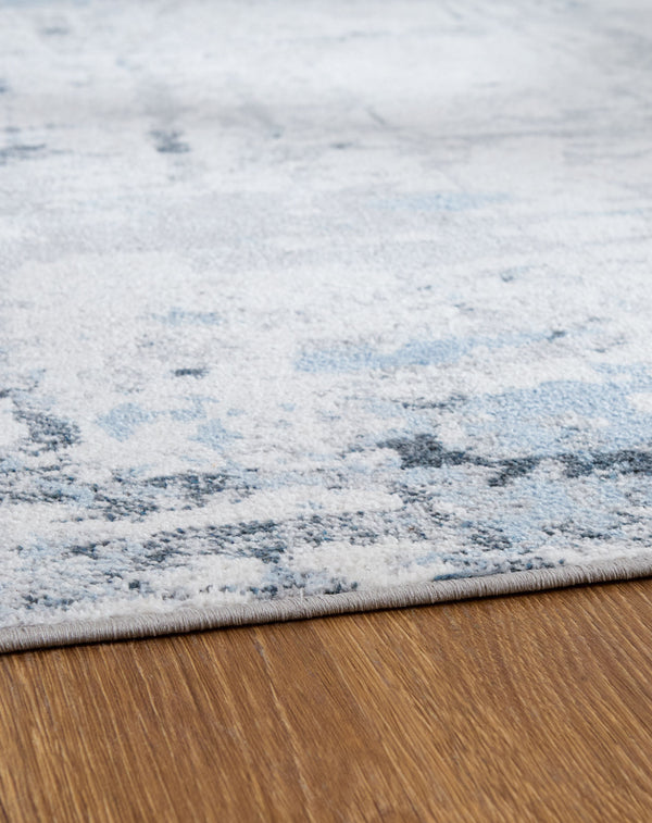  gray and white dance across the plush floor covering