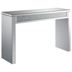 This mirrored console table features clean lines and a contemporary design, highlighted by a central inlay of sparkling acrylic crystals. The sturdy frame and smooth mirrored surfaces create a striking, modern aesthetic that elevates any room. The acrylic