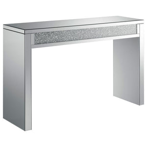 This mirrored console table features clean lines and a contemporary design, highlighted by a central inlay of sparkling acrylic crystals. The sturdy frame and smooth mirrored surfaces create a striking, modern aesthetic that elevates any room. The acrylic