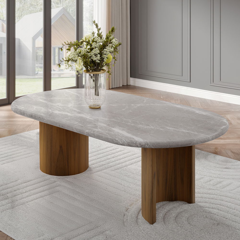 The Darcy dining set features a stunning oval marble top, offering a luxurious touch to your dining space. Supported by elegant double pedestals, this fixed table top exudes both strength and style. Paired with padded seat and back cushion side chairs, th