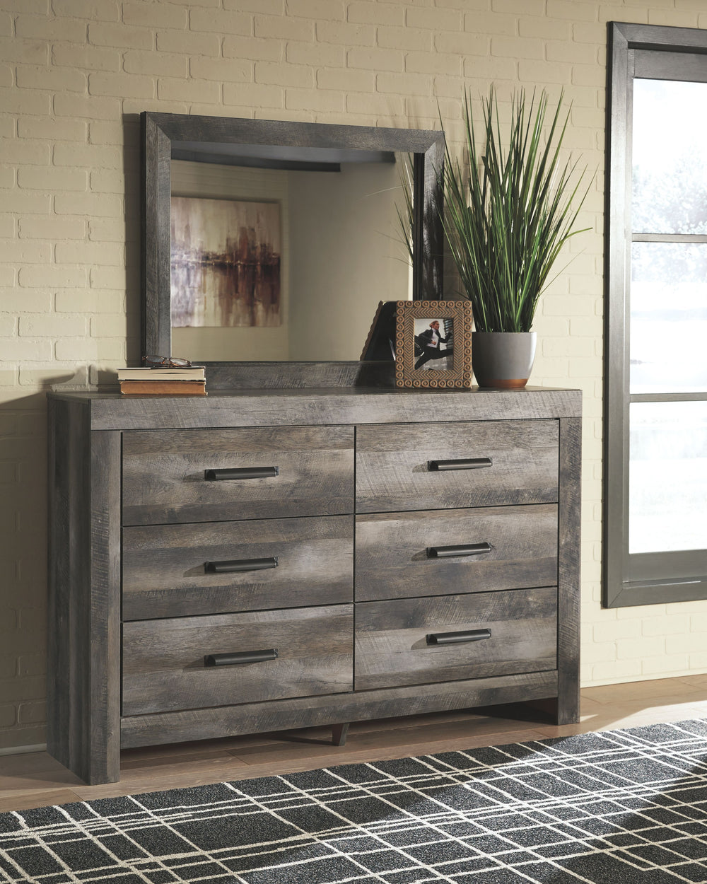 This dresser and mirror set is sure to win your heart with its daring designer take on modern rustic. The dresser and mirror-'s crisp, clean and minimalist-chic profile is enriched with a striking replicated oak grain with thick plank styling and a weathe