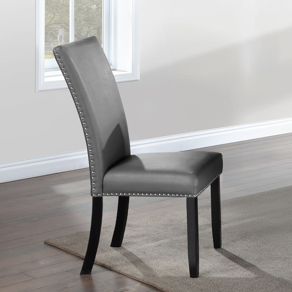 The Caralin dining set brings elegance and modern flair to any dining room. The rectangular table features a thick, engineered stone top with a U-shaped base, creating a stunning focal point. The fixed table top offers stability, while the upholstered cha
