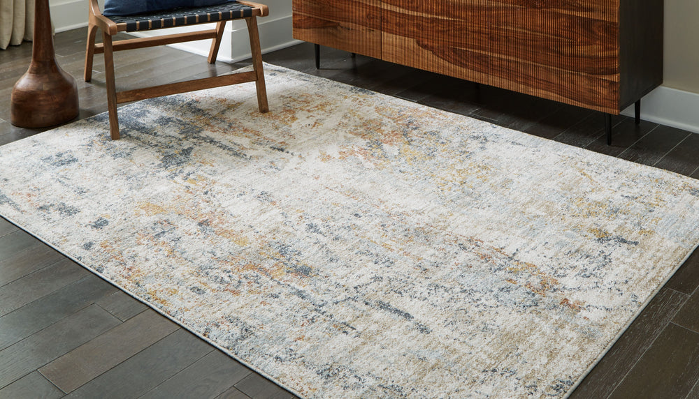 Loaded with visual textureâ€”and decidedly understated on colorâ€”this area rug is the essence of earthy, organic style. Abstract patterns dance across the pile in a pleasing design elevating your decor. It transitions from traditional to contemporary spa