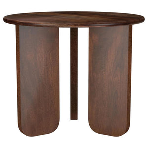 Instill an organic sense of artistry in your living space with this beautifully crafted end table. Made from solid mango wood, it features a deep brown finish that highlights the natural wood grain for added character. The round tabletop provides a stylis