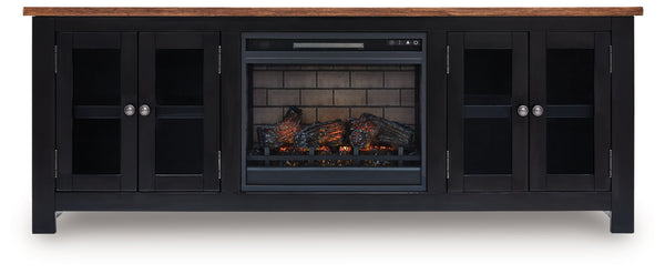 Raise the bar on modern farmhouse style with this TV stand with electric fireplace. Its sturdy silhouette and casual good looks are accentuated with a two-tone finish, which pairs a warm satin black base with a contrasting butcher block veneer top. Glass 
