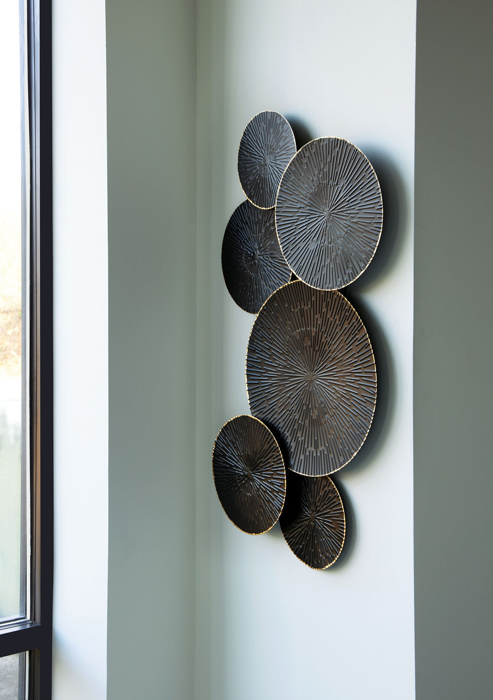 With refined craftsmanship and metal art, this wall sculpture is long lasting and timeless. The perfect combination of workmanship and aesthetics, its geometric design in a black and goldtone finish is sure to make a statement.<br/><br/><b>Product Feature