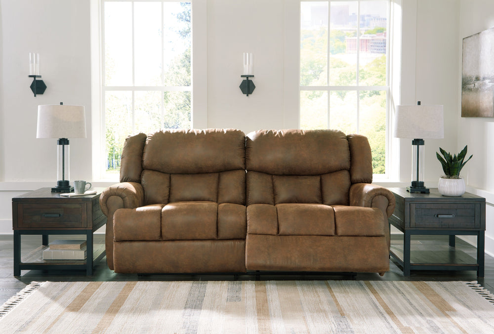 Expansive elegance. This reclining sofa makes a sizable style statement. Its large scale enhances the luxe appearance, magnifying the beauty of richly warm brown faux leather. Polishing off the piece is an effortless reclining motion, which adds a layer o