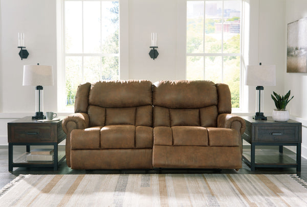  magnifying the beauty of richly warm brown faux leather. Polishing off the piece is an effortless reclining motion