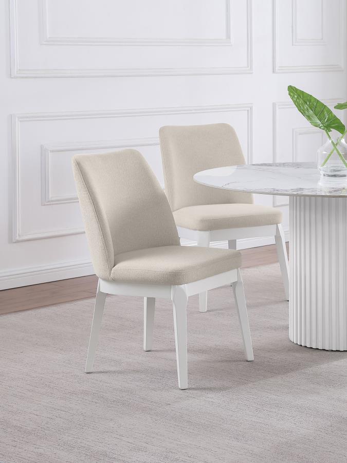 Instill a light, airy sensibility with a set of two modern dining chairs. Each side chair offers excellent comfort and support, complete with foam cushions and rubberwood framing. The set features a white finish over straight, splayed legs and an apron, c