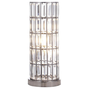 A sleek silhouette brings elegance and regality to a modern three-light table lamp. Adorned with a curtain of sparkling rectangular crystals, it offers glam elegance on a console or side table. Tucked within its column silhouette are three energy efficien