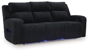 Trend-right style, meet irresistible modern function. Your living room gets a cozy-cool upgrade with this power reclining sofa. Curl up in its ultra-chic corded upholstery and recline with one-touch controls. Is it movie night or game time? With ambient L