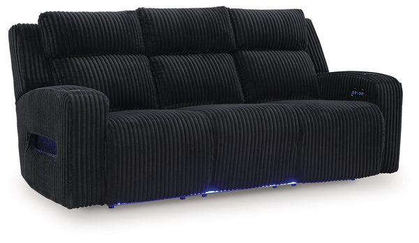 Trend-right style, meet irresistible modern function. Your living room gets a cozy-cool upgrade with this power reclining sofa. Curl up in its ultra-chic corded upholstery and recline with one-touch controls. Is it movie night or game time? With ambient L