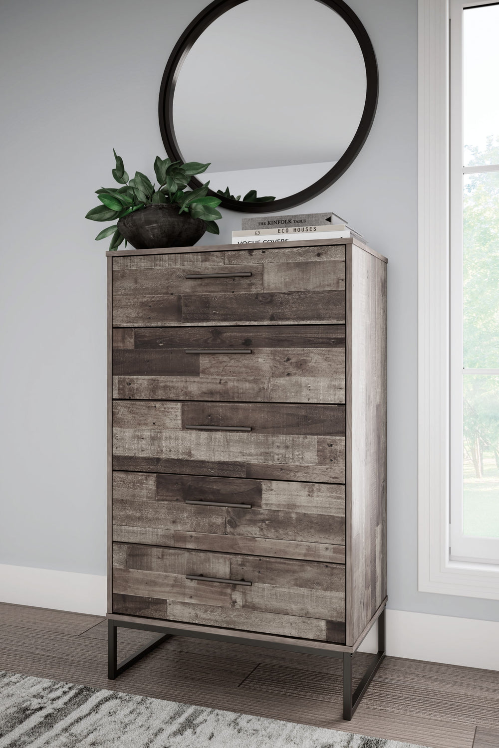 Streamlined design and a stunning finish come together in one simply extraordinary piece. This chest of drawers is sure to impress with five smooth-operating drawers, canted metal legs and a rustic butcher block finish over replicated pine grain texture. 