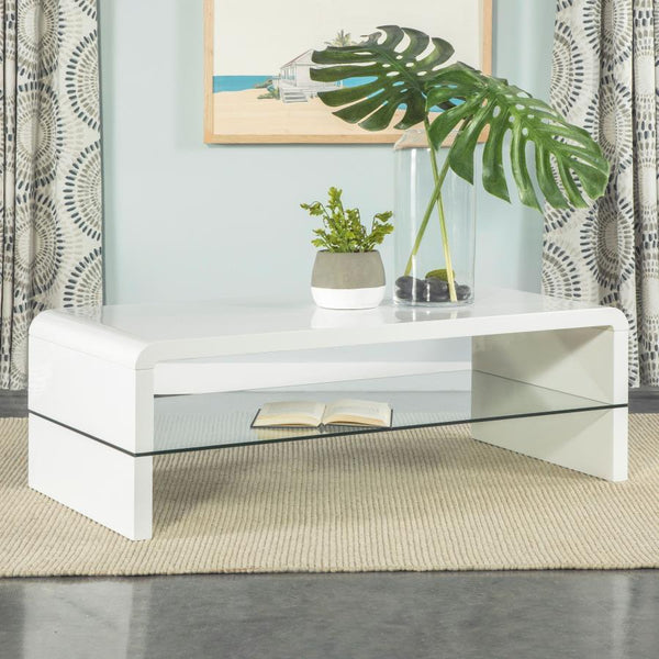  high-gloss white finish and clean lines. Its rectangular tabletop flows seamlessly into waterfall edges